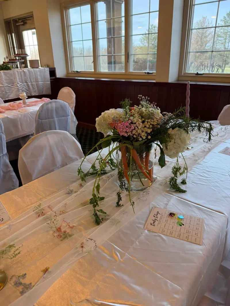 Guest table beside the venue's large windows overlooking the grounds