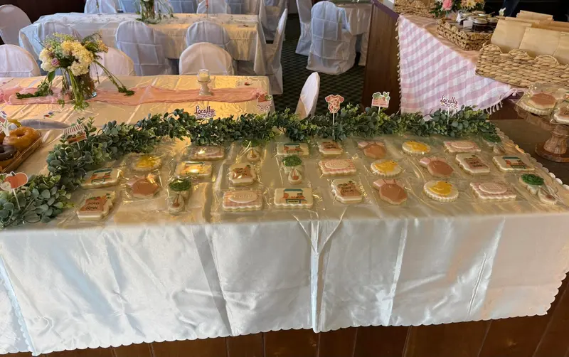 Garden-themed buffet with greenery and soft floral decorations