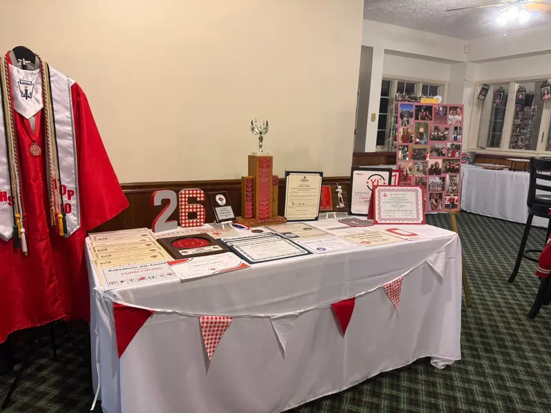 Personalized graduation display table in the fireside room