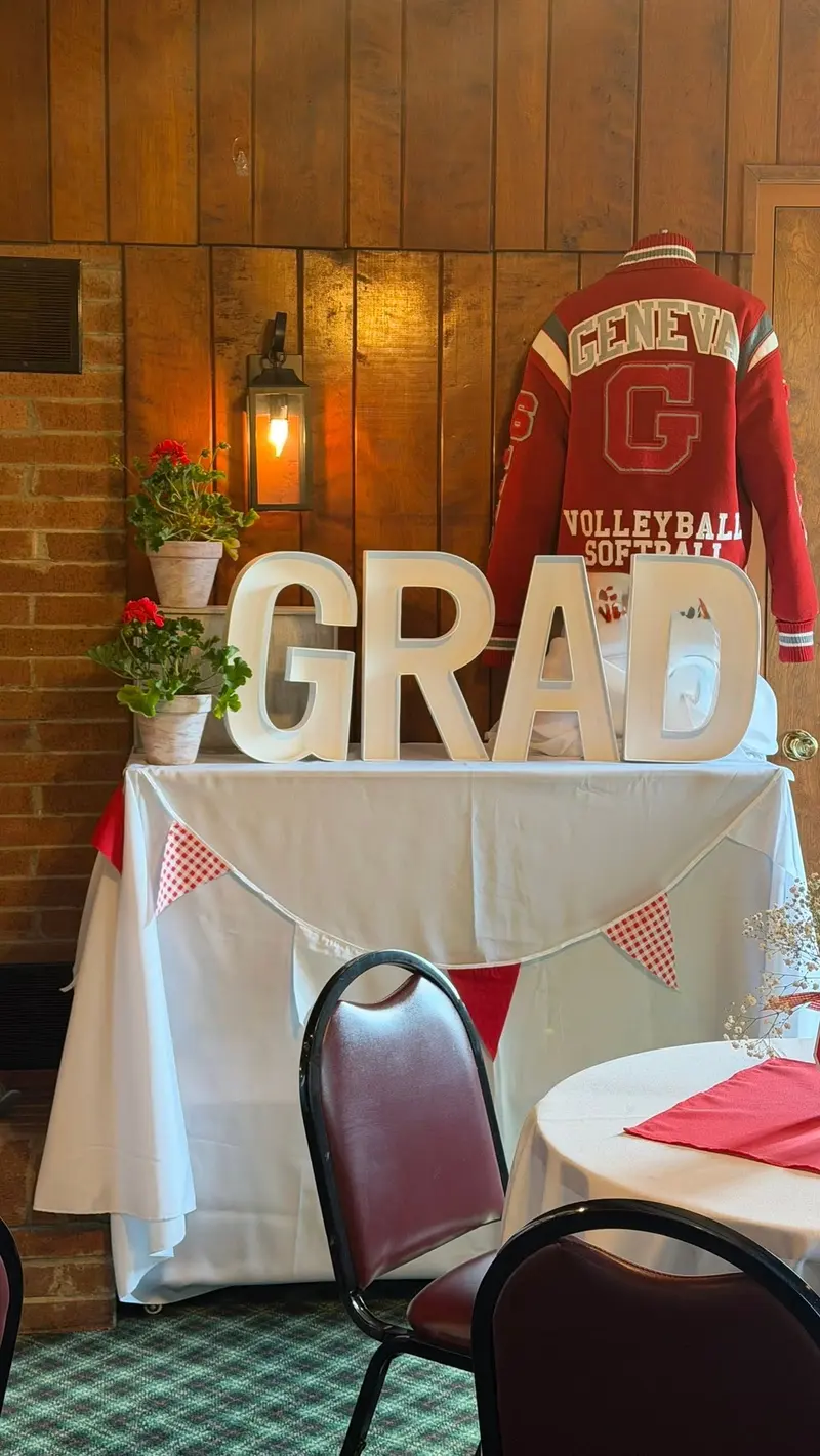 Personalized graduation keepsake display beside the brick fireplace