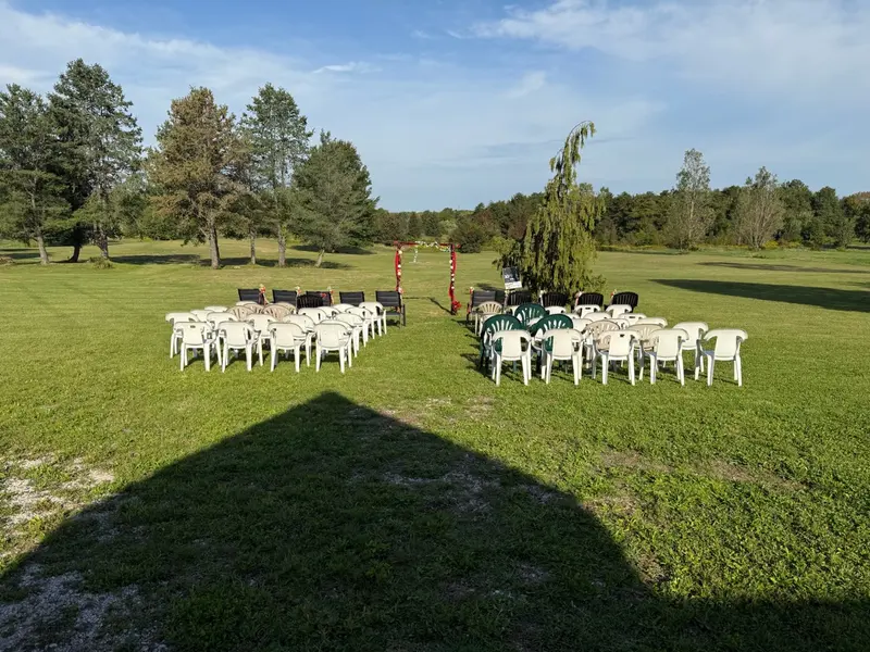 Outdoor wedding ceremony seating arranged on Chapel Hill Venue's open lawn