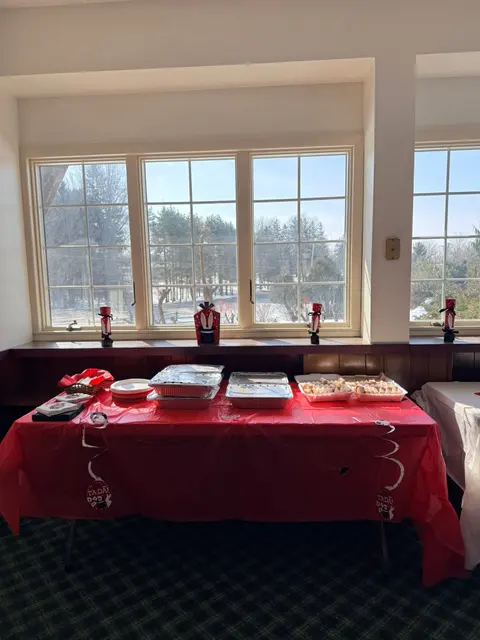Guest seating beside large windows overlooking the winter landscape
