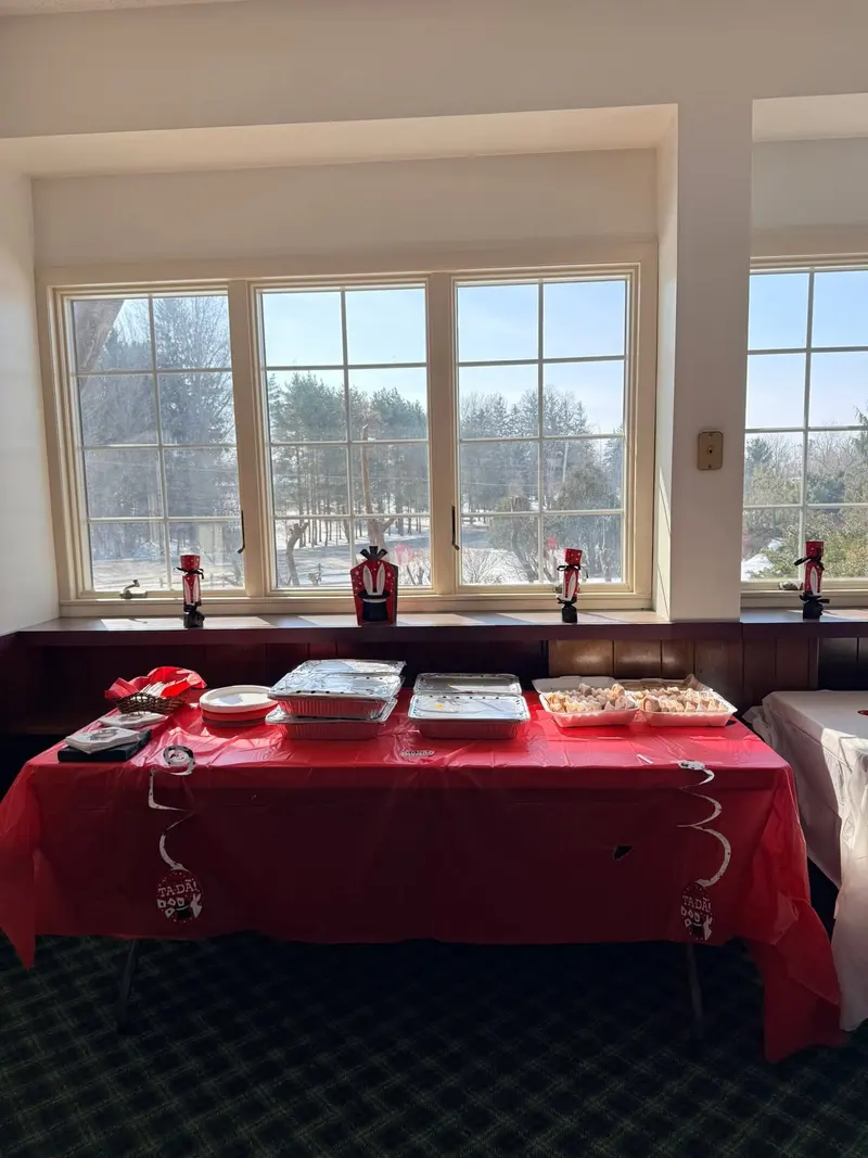 Guest seating beside large windows overlooking the winter landscape